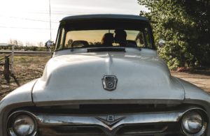 couple kissing in classic pickup