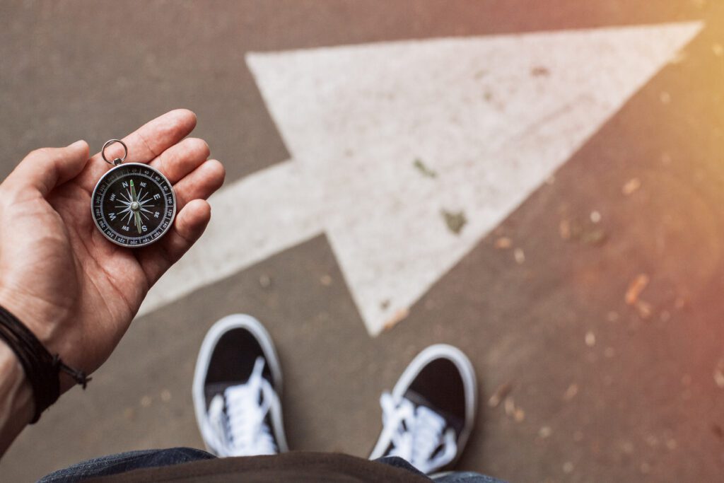 Executive navigating career direction with compass in hand