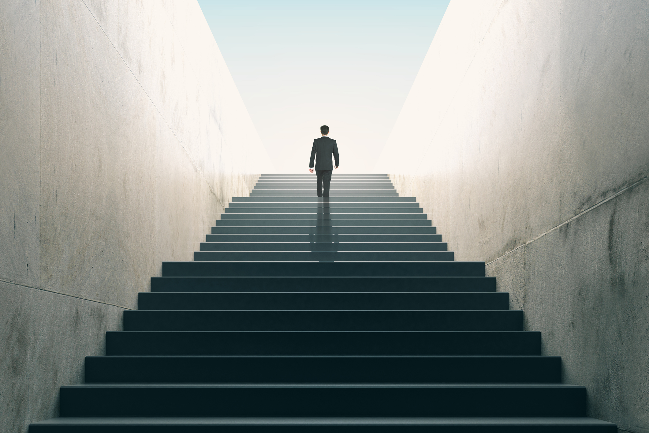 Unlocking Leadership Potential with Creative Competencies: A Therapist’s Perspective Business professional walking up stairs toward success and leadership growth